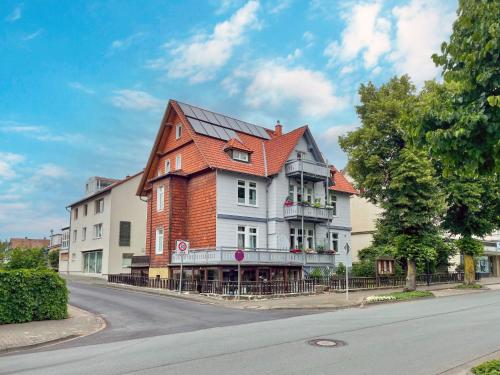 a large house with an orange roof on a street at Apartment Apartment 54 by Interhome in Bad Arolsen
