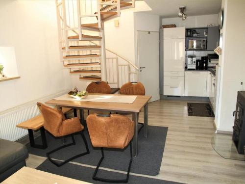 a kitchen and living room with a table and chairs at Holiday Home Adele - Allergiker geeignet by Interhome in Zandt