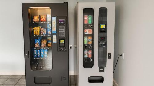 two vending machines with food and drinks in them at Gated 2 Double Beds Studio with Full Kitchen 122 in Baton Rouge