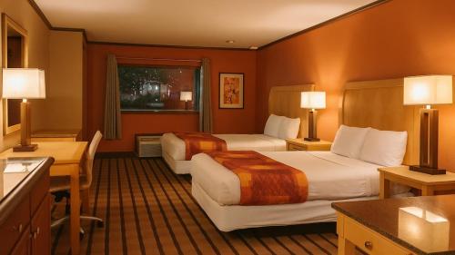 a hotel room with two beds and a kitchen at Gated 2 Double Beds Studio with Full Kitchen 122 in Baton Rouge