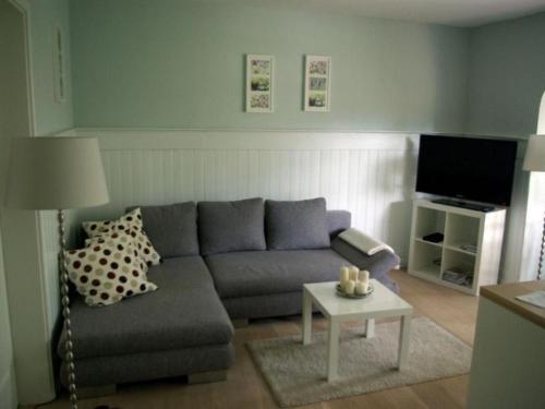 a living room with a couch and a table at Apartment Seerose by Interhome in Bleckede