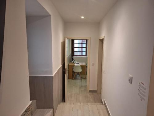 a hallway of a house with a stairway leading into a room at Lemago Porto Apartments - São Bento in Porto