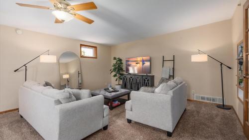 a living room with two couches and a ceiling fan at 2BR Condo by Lake w Deck, Jetted Tub - Raindrop in Pepin