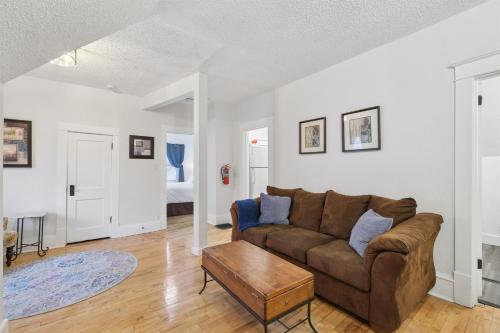 a living room with a couch and a table at 1BR Apartment Across from Como Lake - Bayberry in Saint Paul