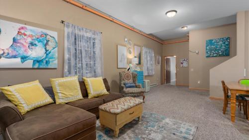 a living room with a couch and chairs and a table at Three Connected Quirky Condos By Beach! - Twilight Condo in Pepin