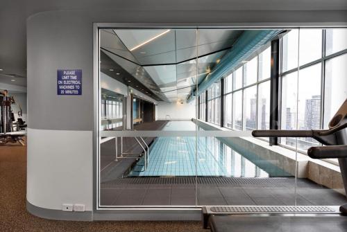 a swimming pool in the middle of a building at Spacious landmark in the heart of CBD in Melbourne