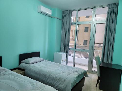 En eller flere senge i et værelse på Odan Apart