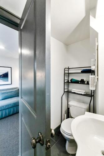 a bathroom with a toilet and a sink at Montlake Studio in Spite House in Seattle