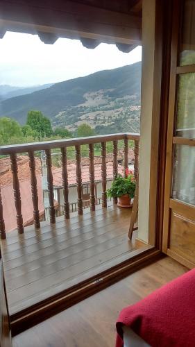 a balcony with a view of a mountain at Casa Fidela in Lomeña