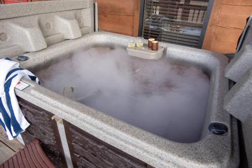 a bath tub filled with a lot of steam at Sweet Serenity in Gatlinburg