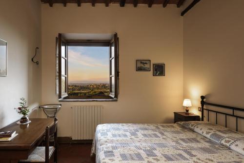 Cama o camas de una habitación en La Casa Delle Querce