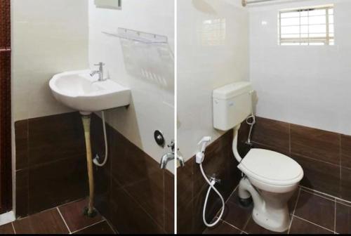 a bathroom with a toilet and a sink at SLP Residency in Mysore