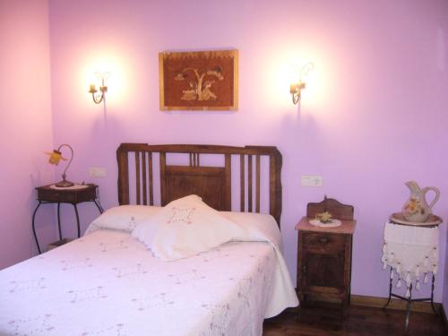 Casa Maseda tesisinde bir odada yatak veya yataklar