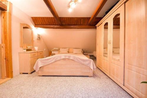 a bedroom with a large bed in a room at Apartmánek u Špičáku in Albrechtice v Jizerských horách