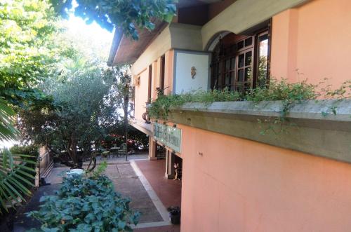 a building with a balcony with plants on it at La Casa di Enrico in Caorle
