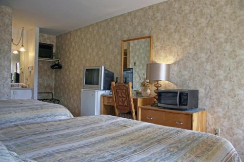 Postel nebo postele na pokoji v ubytování Motel Bellevue