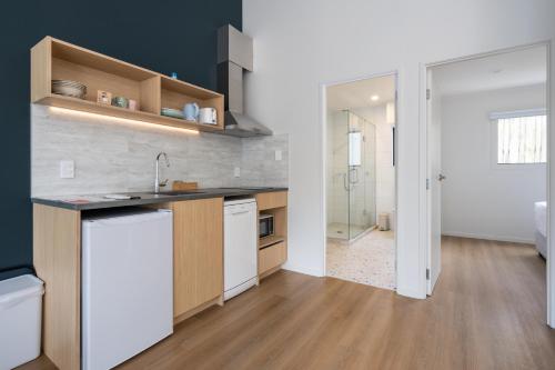a kitchen with a sink and a counter top at Mt Wellington Motel in Auckland