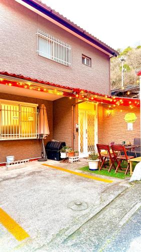 a house with a patio with a table and chairs at Grace House Hill Paradise Atami in Atami
