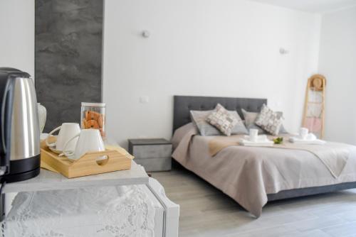 a bedroom with a bed and a table with a coffee maker at Profumo di Vigna - Roero in Occhetti