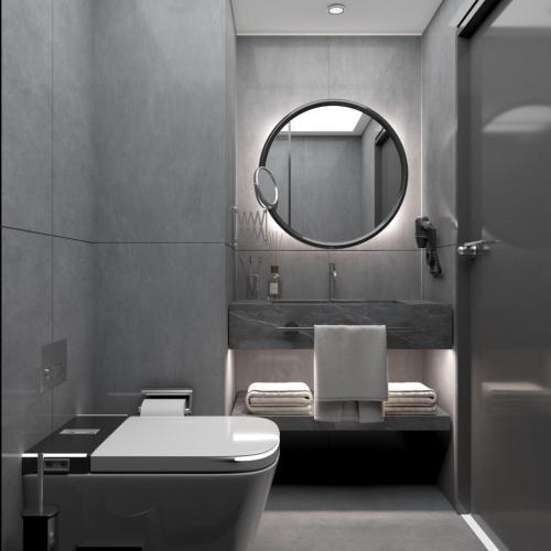 a bathroom with a toilet and a mirror at Diamond Of Bodrum in Bodrum City