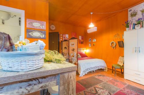 a room with a bedroom with a bed and a table at Casa Mistral in Soriano nel Cimino