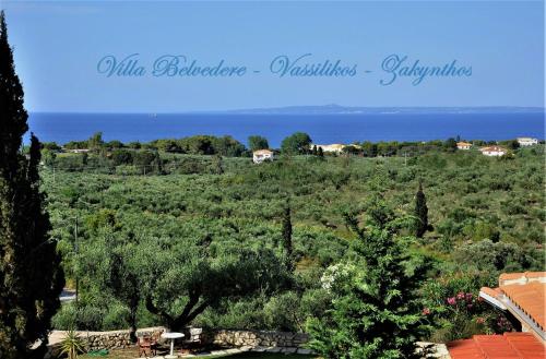 a view of a field of trees and the ocean at Villa Belvedere - Panoramic Sea View apts in Vasilikos