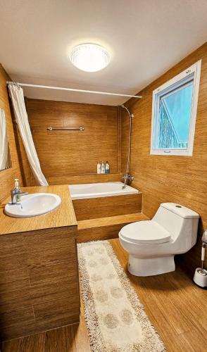 a bathroom with a toilet and a sink and a tub at Anusorn Villas & Garden Oasis - Peaceful Chiang Mai Hideaway in Ban Ton Chok