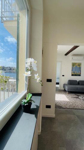 a living room with a view of the ocean at Comodissimo Gaslini e mare in Genoa