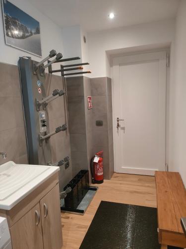 a kitchen with a shower in the corner of a room at appartamento PANORAMA in Pozza di Fassa