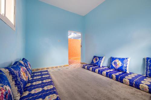 a blue living room with a couch in a room at Private Villa with Pool and Hammam Marrakech in Oulad Akkou
