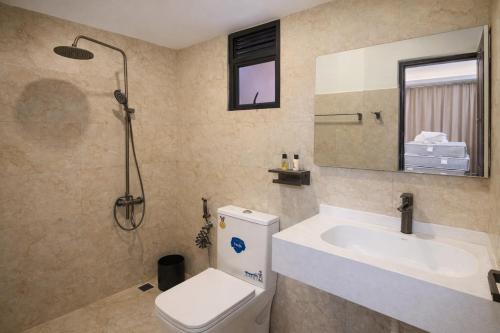 a bathroom with a sink and a toilet and a shower at Monaara Leisure - Ella in Ella