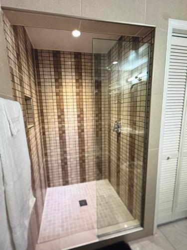 a shower with a glass door in a bathroom at Escape to paradise in Providenciales