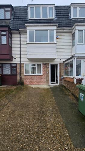 an empty driveway in front of a house at Cosy Private Room in Greater London Easy Access to City & Excel in London