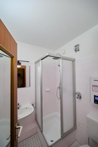 a bathroom with a shower and a tub and a toilet at Asmus Unterkunft in Immenstadt im Allgäu