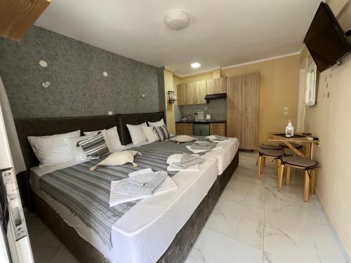 Posteľ alebo postele v izbe v ubytovaní Corner Studios