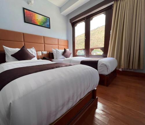 Llit o llits en una habitació de Hotel Wang Villa