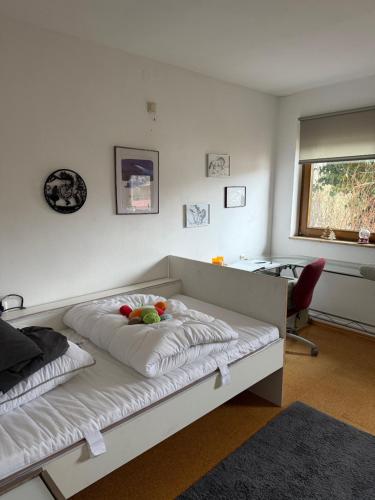 a bedroom with a bed with fruit on it at Ferienwohnung Landleben in Bühlertann