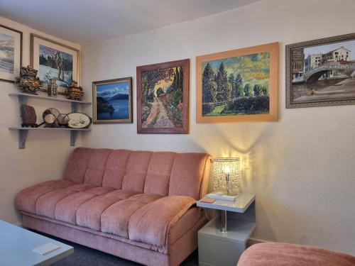 a living room with a couch and pictures on the wall at Canterbury within the city wall - Sleeps 7 - Pet-Friendly with Garden in Canterbury