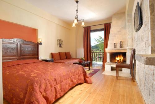 a bedroom with a bed and a fireplace at Mikri Arktos in Elati