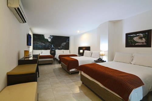Katil atau katil-katil dalam bilik di Hotel Kahvé