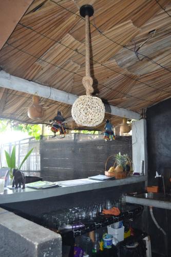 a kitchen with a counter with a hanging ceiling at Check Point in Unawatuna