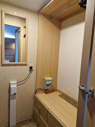 a room with a counter with a window and a room with a counter at Ocean Front Lodge in Hartlepool