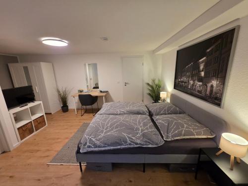 a bedroom with a large bed in a room at Apartment Tanne in Düsseldorf