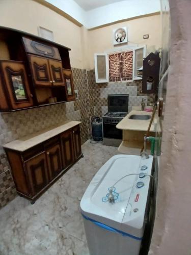 a kitchen with a sink and a counter in a room at Aylan in Siwa