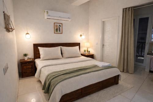 a bedroom with a large bed and a window at Guest Stay Inn 1BHK in Zirakpur