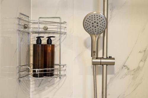 a bathroom with a shelf and a comb at Woodbridge Property at Karon Butterfly in Karon Beach