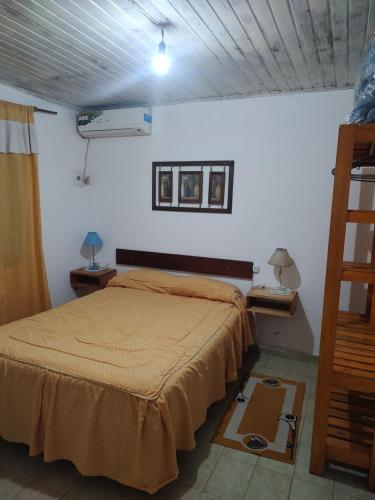 a bedroom with a bed in a room at DepartamentosJYM in Federación
