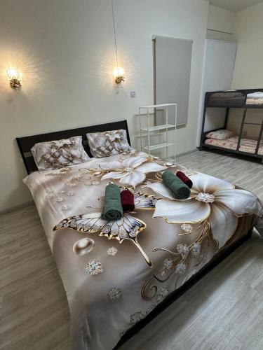 a bedroom with a large white bed with decorations on it at Near Finikoudes Beach 15 in Larnaca