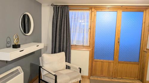a living room with a chair and a window at One bedroom self-contained accommodation in Lerwick