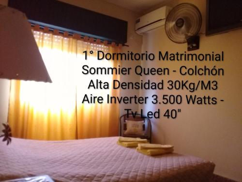 a poster of a bedroom with a bed with towels at Vergniaud 70 in Colón
